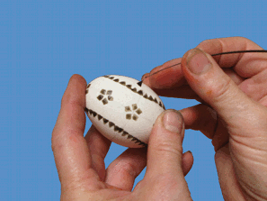 applying wax with a feather